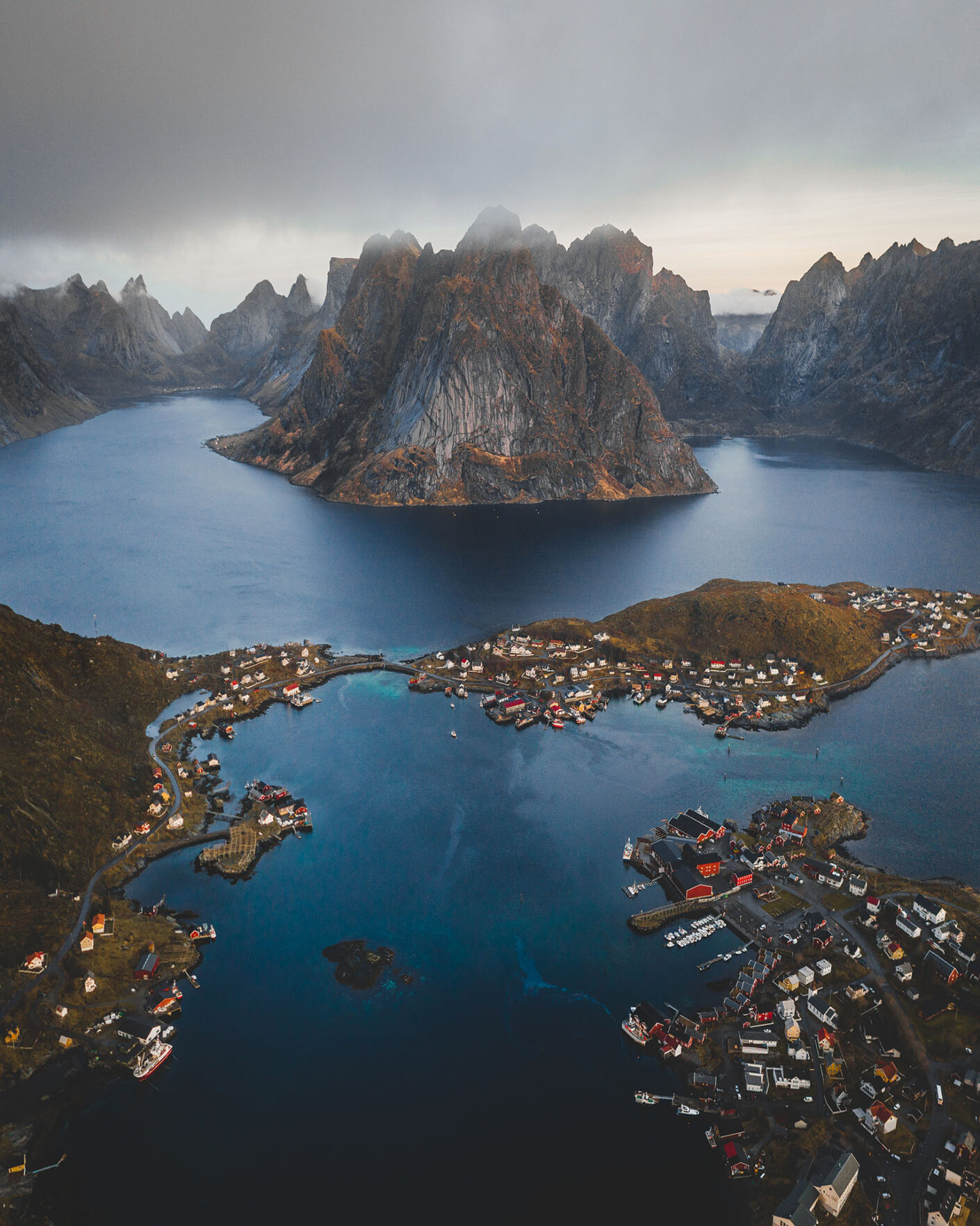 The Lofoten Islands are Norway’s Arctic masterpiece—sharp peaks, deep fjords, and red cabins by the sea. Travel with Off The Map